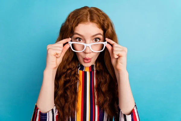 Photo of hooray orange hairdo young lady look wear spectacles colorful shirt isolated on blue color background — Stock Photo, Image