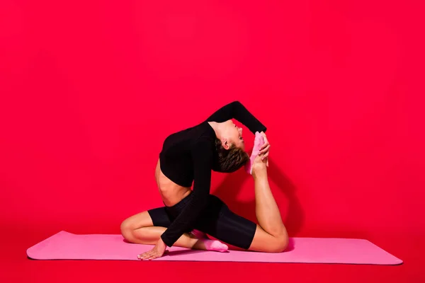 Profile photo of tender gorgeous stunning lady stretch body wear black cropped top isolated red color background — Stock Photo, Image