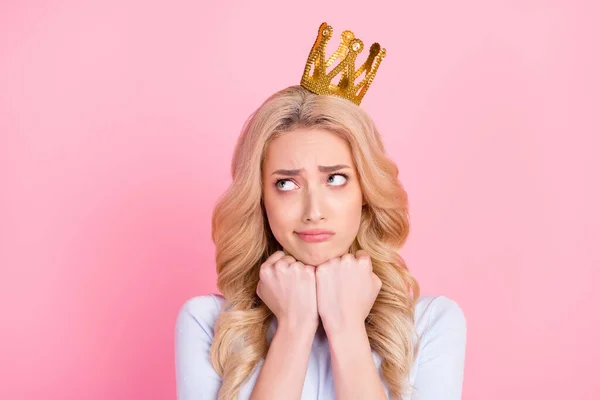 Photo of hesitant young unhappy woman look empty space wear golden crown isolated on pink color background — Stock Photo, Image
