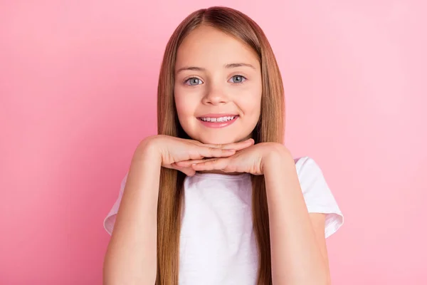 Photo of nice blond small girl hands face wear white t-shirt isolated on pink color background — Stock Photo, Image