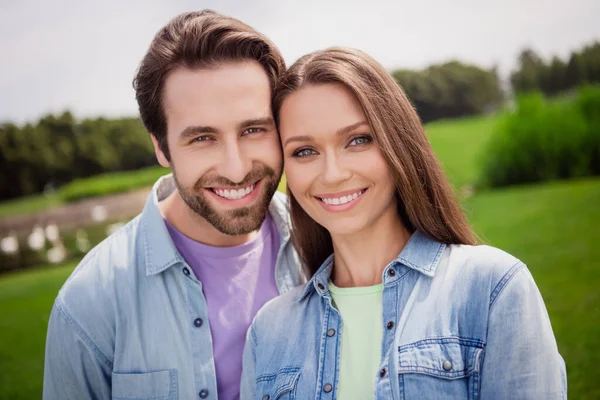 Portrait of good mood smiling couple relaxing outdoors in park countryside have romantic date outside wear denim shirt — Stock Photo, Image