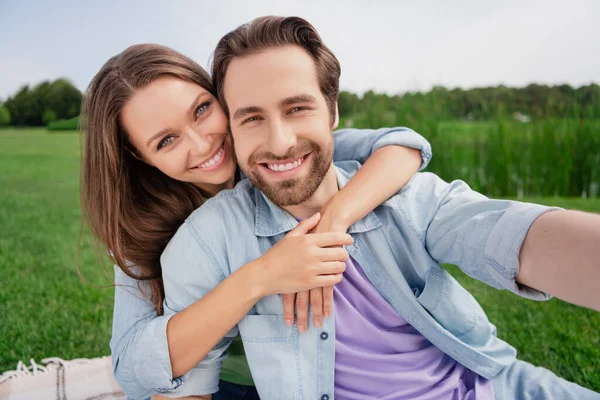 Photo of cheerful smiling good mood couple take selfie relaxing together outside outdoors wife cuddle husband love story — Stock Photo, Image