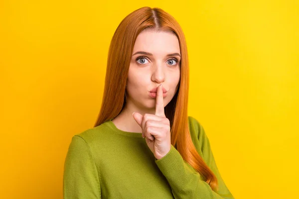 Photo of quiet orange hair millennial lady finger lips wear green pullover isolated on yellow color background — Stock Photo, Image
