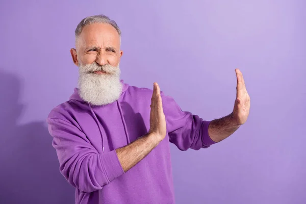 Portrait of elderly retired pensioner grey-haired man wear hoodie showing no sign disagree isolated over purple violet color background — Stock Photo, Image