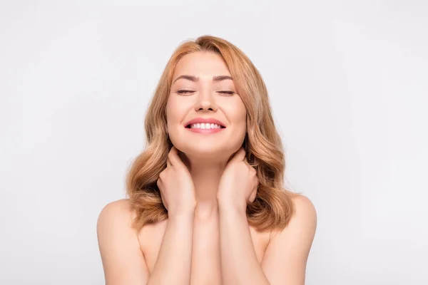 Photo portrait woman touching neck doing skin treatment smiling overjoyed isolated white color background — Stock Photo, Image