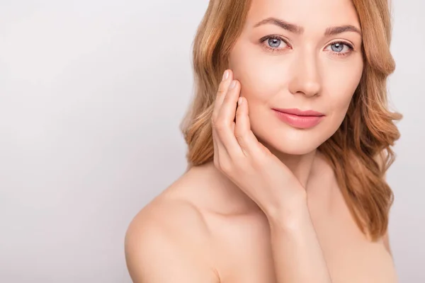 Cropped photo portrait woman naked shoulders hydrating anti age cream on cheek isolated white color background — Stock Photo, Image