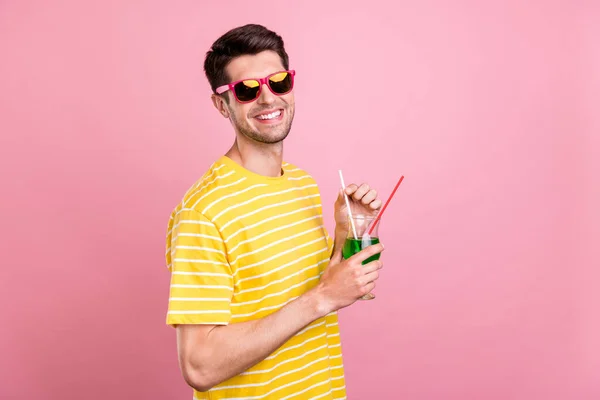 Profile side view portrait of attractive cheerful guy drinking beverage having fun chill isolated over pink pastel color background — Stock Photo, Image