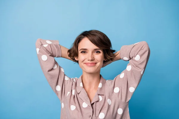Top above high angle view photo of cheerful charming woman relax wear pajamas hold hands head isolated on blue color background — Stock Photo, Image