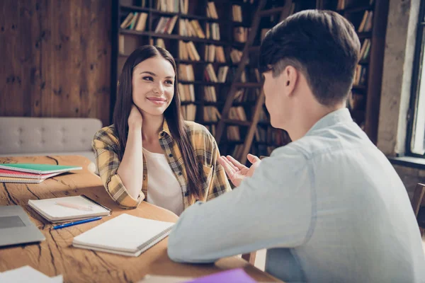 Portrait of two attractive cheerful learners communicating sharing experience at library loft industrial interior indoors — Stock Photo, Image