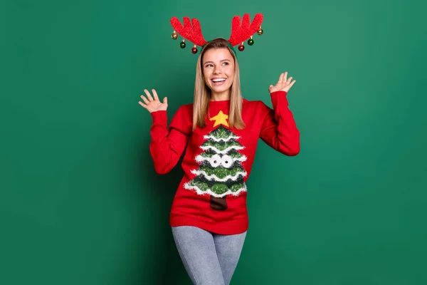 Portrait of attractive amazed funky cheerful girl wearing horns decor having fun isolated over green color background — Stock Photo, Image