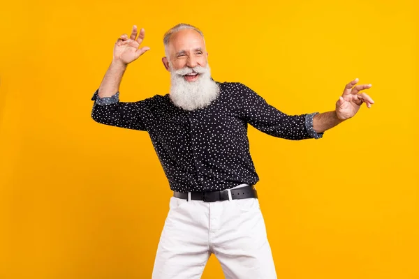 Photo of charming cool old man look empty space dancer summer enjoy isolated on yellow color background — Stock Photo, Image