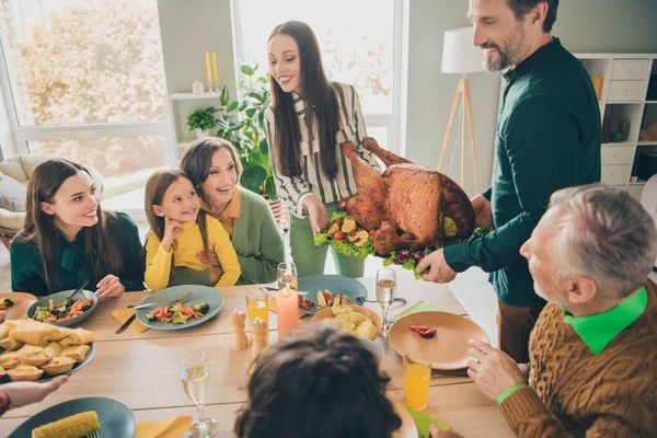 Photo of sweet excited family ready eating holiday turkey smiling sitting table indoors house room — Stock Photo, Image