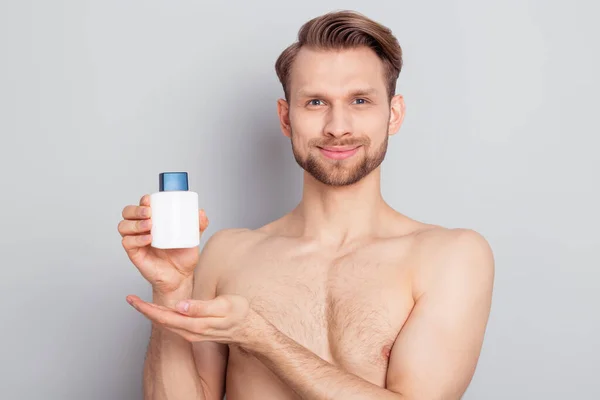 Portrait of nice attractive confident cheery man holding in hands aroma perfume isolated over grey pastel color background — Stock Photo, Image