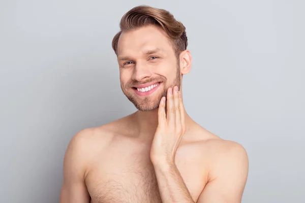 Portrait of attractive cheerful well-groomed guy touching chin perfection isolated over grey pastel color background — Stok Foto