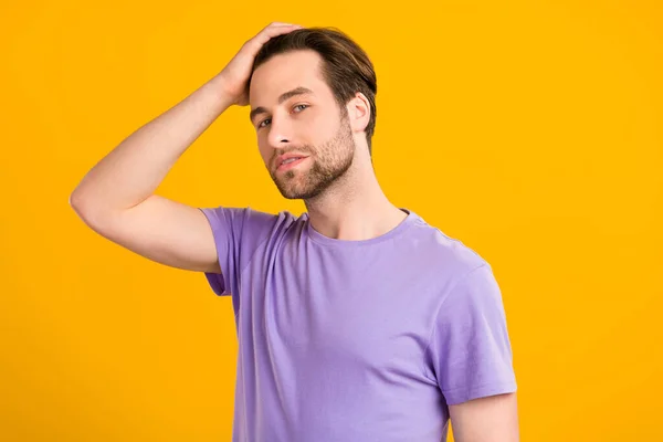 Photo of masculine virile guy touch perfect smooth silky hairdo wear purple t-shirt isolated yellow color background — Stock Photo, Image