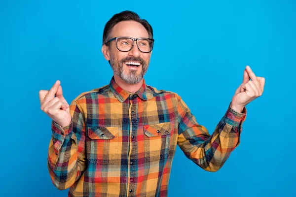 Photo portrait man wearing spectacles checkered shirt smiling dancing at party isolated bright blue color background — Stock Photo, Image