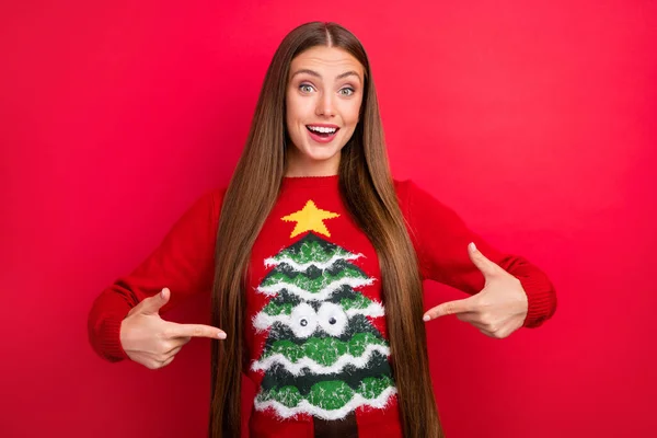 Photo of glad excited girl indicate fingers herself outfit wear ugly ornament sweater isolated red color background — Stock Photo, Image