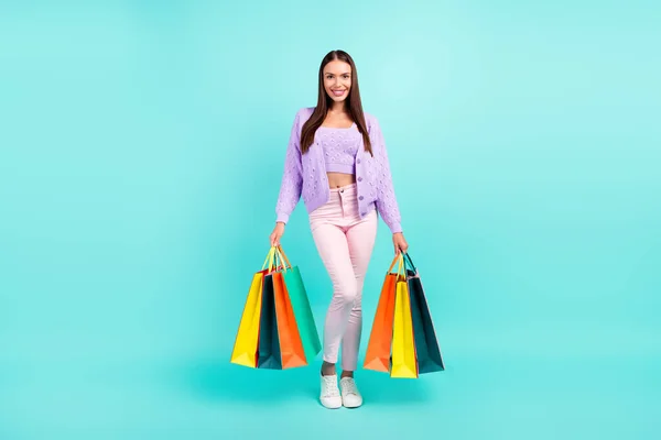 Photo of positive nice client store lady hold shop packages wear purple cardigan isolated turquoise color background — Stock Photo, Image