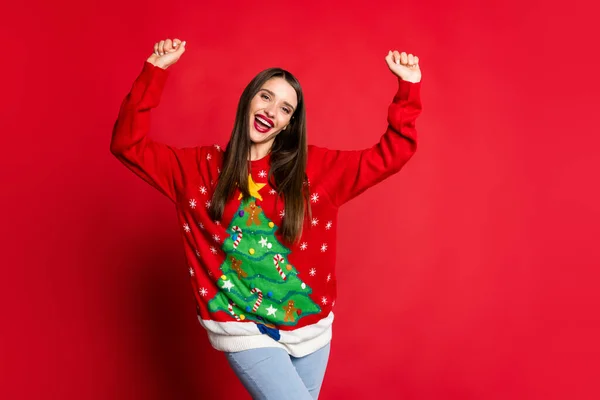 Photo of happy cheerful victorious young woman raise hands good mood win isolated on red color background — Stock Photo, Image