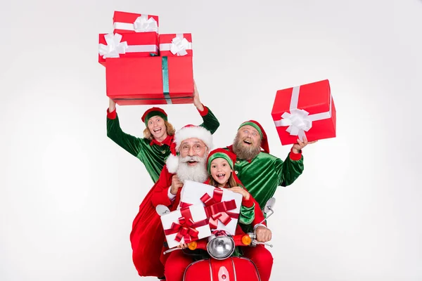 Photo of four party people ride bike hold presents wear santa elf costume isolated white color background — Stock Photo, Image