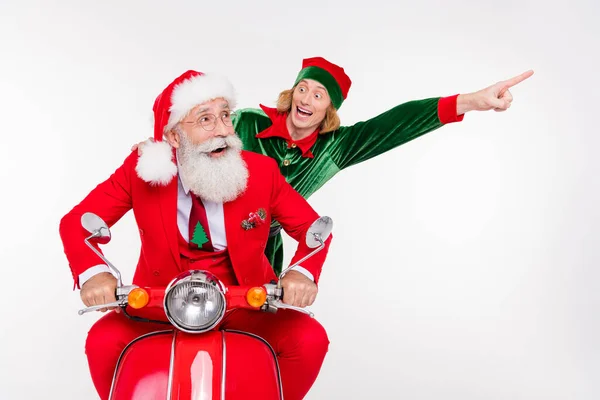 Portrait of attractive cheerful two people riding scooter showing dream copy space December winter isolated over white color background — Stock Photo, Image