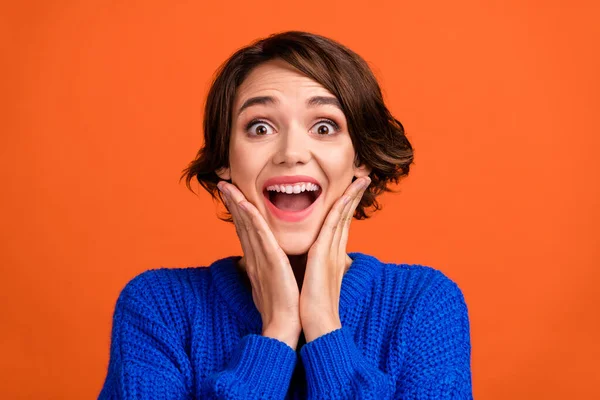 Portrait of attractive cheerful girl great cool sudden news reaction isolated over vibrant orange color background — Stock Photo, Image