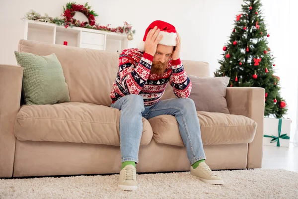 Full size photo of stressed depressed unhappy guy hate new year christmas have problem trouble sit sofa thinking — Stock Photo, Image