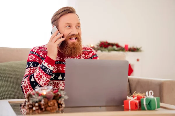 Photo of young man happy positive smile speak talk listen cellphone use laptop atmosphere greeting newyear indoors — Stock Photo, Image
