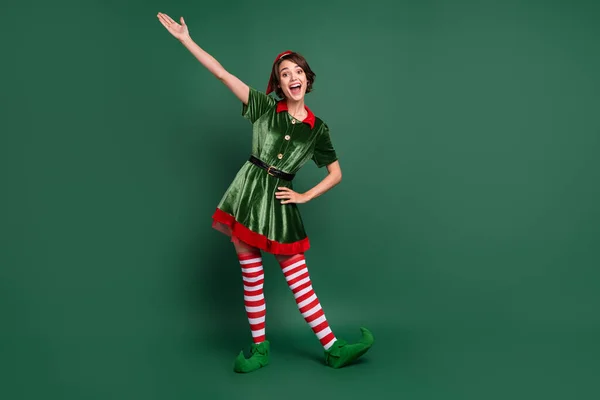 Full length body size view of attractive cheerful funny girl elf having fun celebratory isolated over green color background — Stock Photo, Image