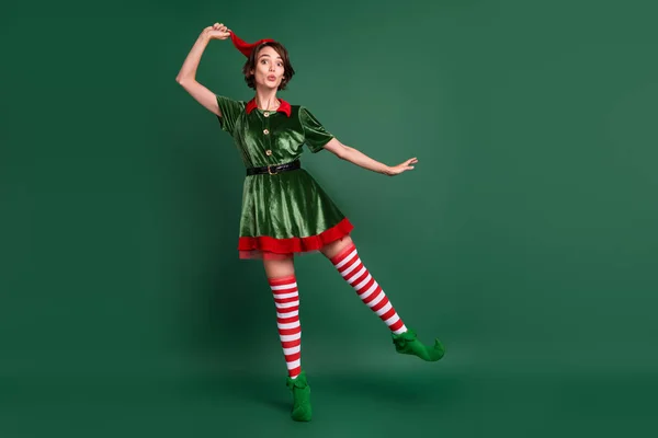 Full length body size view of attractive cheerful amazed funny girl elf fooling having fun isolated over green color background — Stock Photo, Image