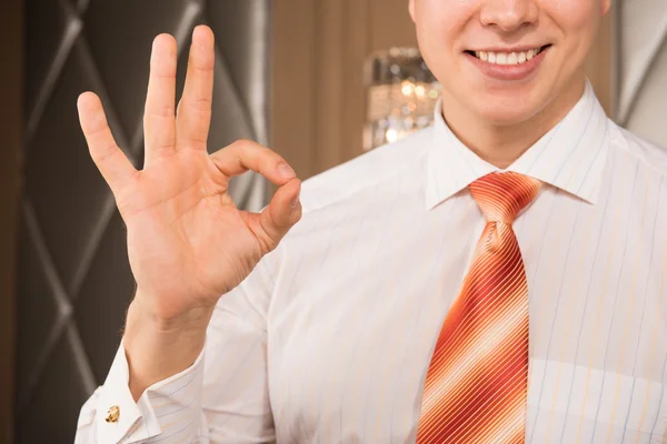 Successful businessman. Cropped image of cheerful young man in formalwear gesturing and smiling — Stock Photo, Image