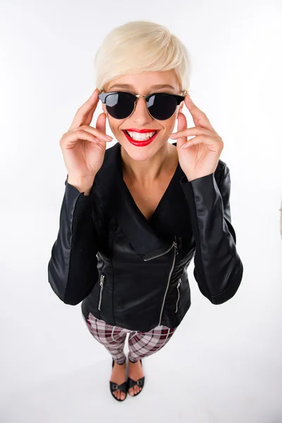 Successful beautiful young woman with red lips adjusting her glasses Stock Photo