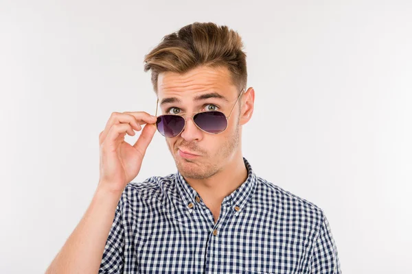 Man grimacing and down on his nose glasses — Stock Photo, Image