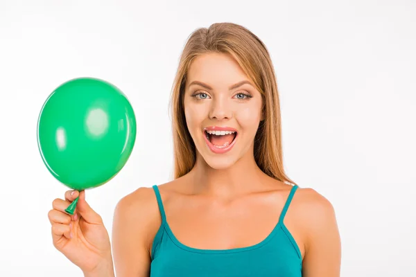 Happy cute girl with green balloon smiling — Stock Photo, Image