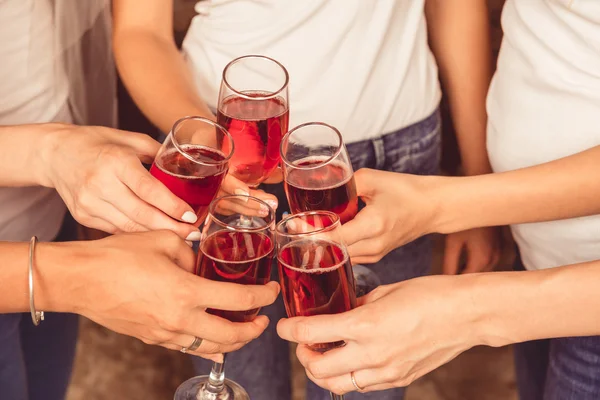 Cheers! girls clink glasses of champagne — Zdjęcie stockowe