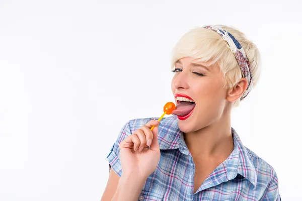 Smiling girl with orange lollipop — Stock Photo, Image