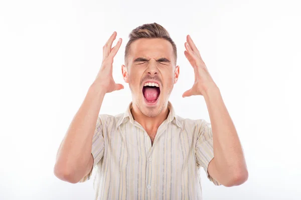 Portrait of a young furious man in striped shirt — Stock Photo, Image