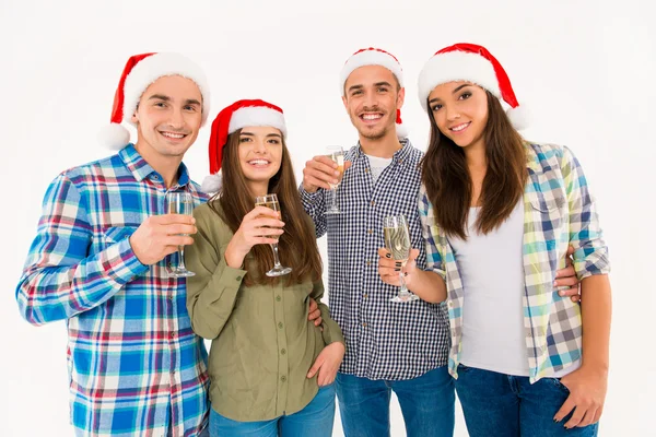 Gyönyörű emberek santa kalap xmas ünnepli pezsgővel — Stock Fotó