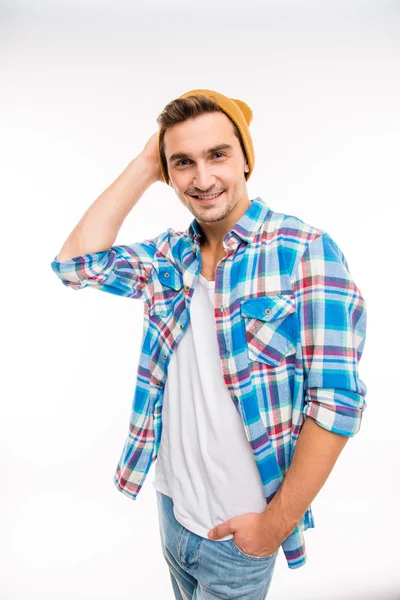 Handsome cheerful young man in hat — Stock Photo, Image