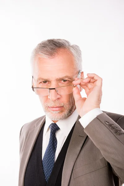 Old businessman in an elegant suit with glasses — Stock Photo, Image