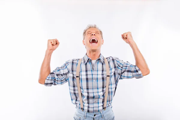 Confident happy aged cheerful man in suspenders — Stock Photo, Image