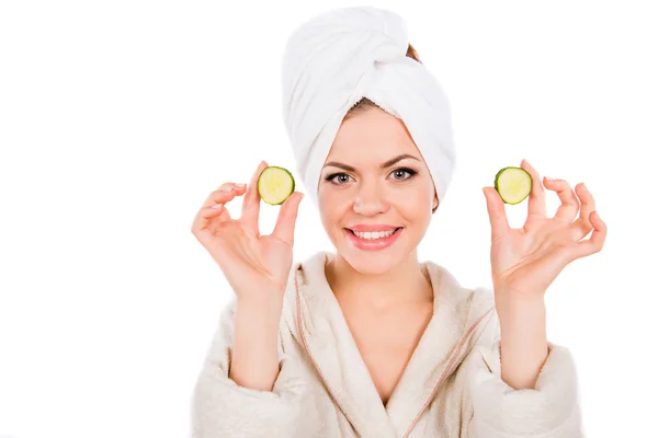 Young girl in spa with cucumber slices in her hands — Stock Photo, Image