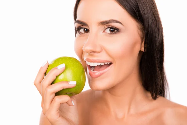 Beautiful healthy toothy girl biting  green apple — Stock Photo, Image