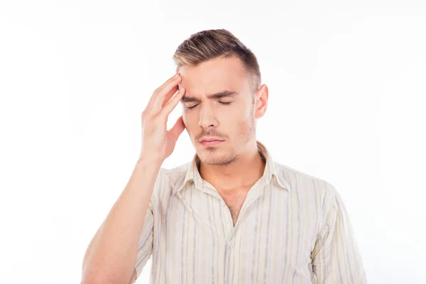 Handsome young man touching his head with one hand feeling stron — Stock Photo, Image