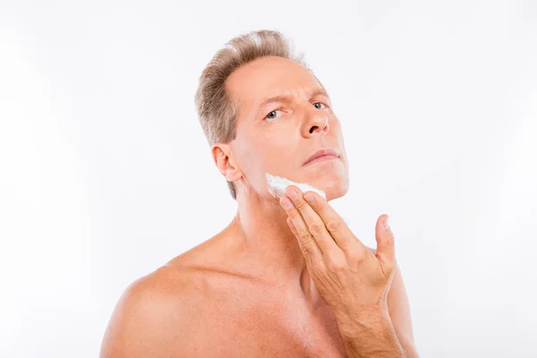 Handsome mature man creaming in front of camera — Stock Photo, Image