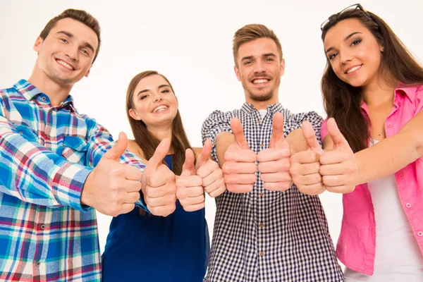 Grupo alegre feliz mostrando polegares para cima — Fotografia de Stock