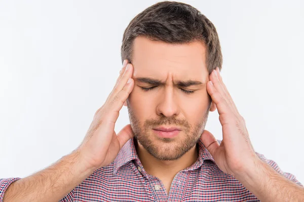 Handsome man touching his head suffering from headache — Stock Photo, Image