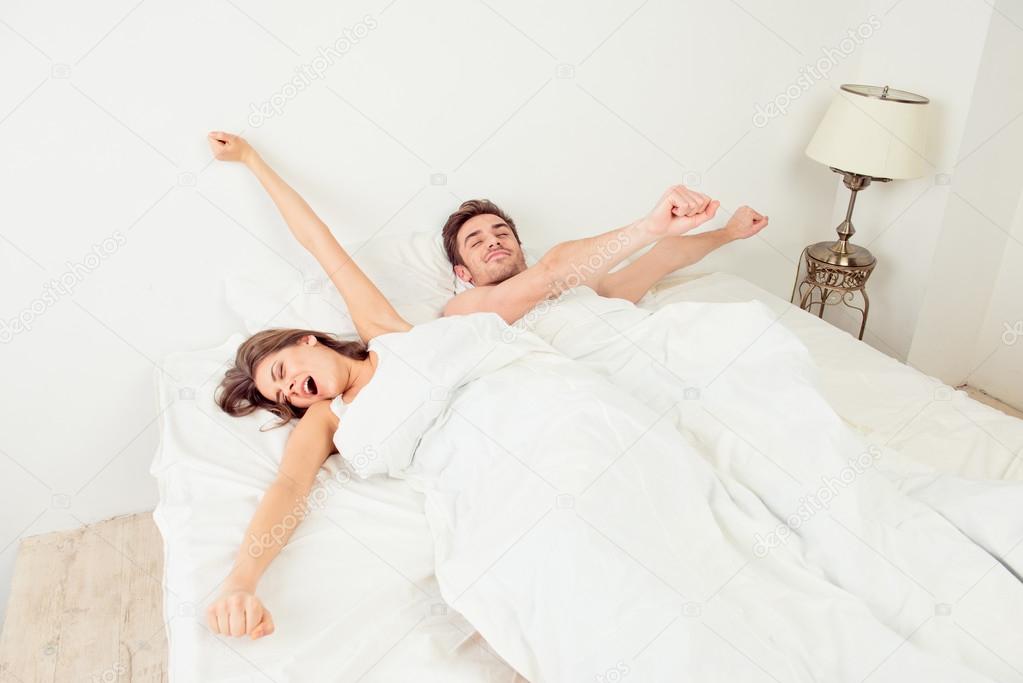 Cute Couple In Love Lying In The Bed Waking Up Stock Photo