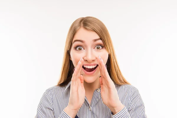 Great news! Cheerful young woman holding hand near mouth — Stock Photo, Image