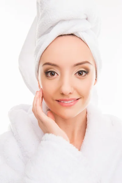 Close up photo of cute girl with towel on her head touching her — Stock Photo, Image